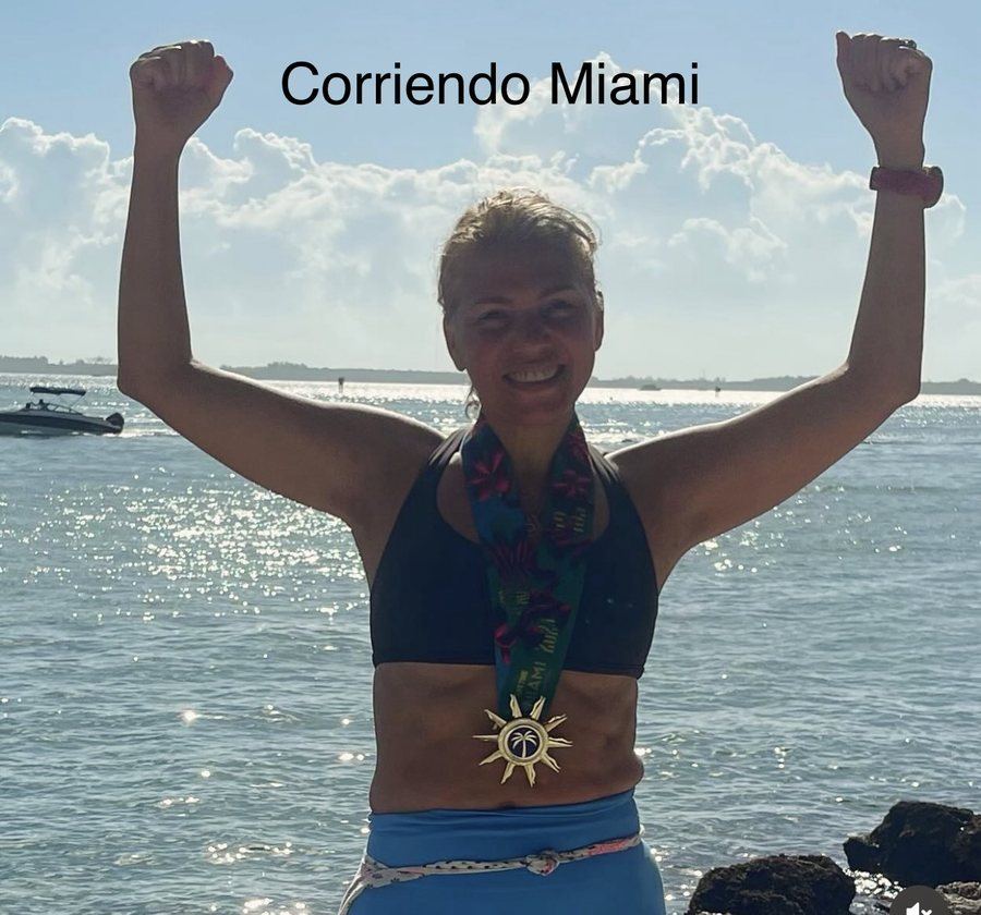 Dr. Karina Rieke celebrating with a race medal in Miami